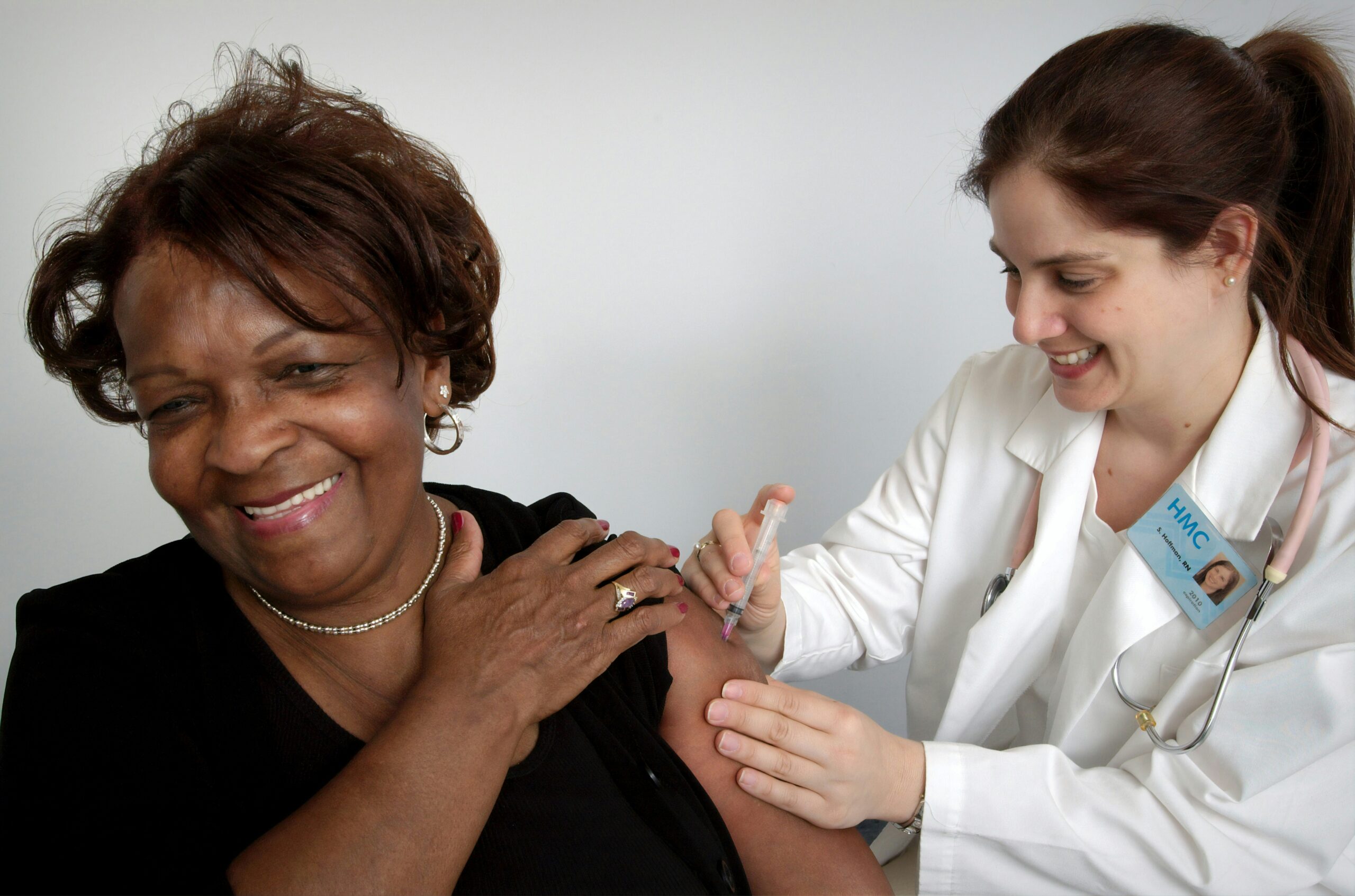 Patient receiving vaccination in clinic.
